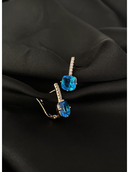 Сережки з блакитним стразом англійський замок золотого кольору 30721